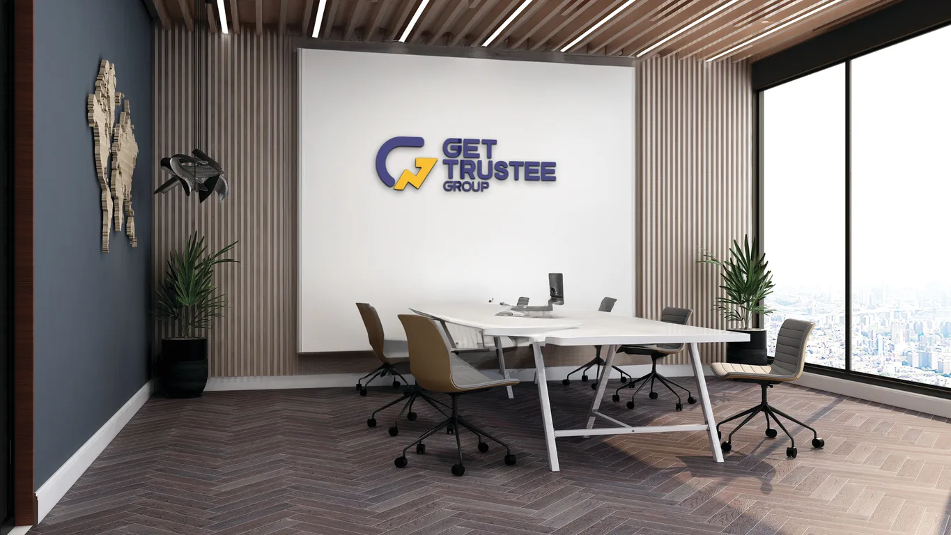 GET Trustee Group indoor signage mounted on a meeting room wall behind a conference table