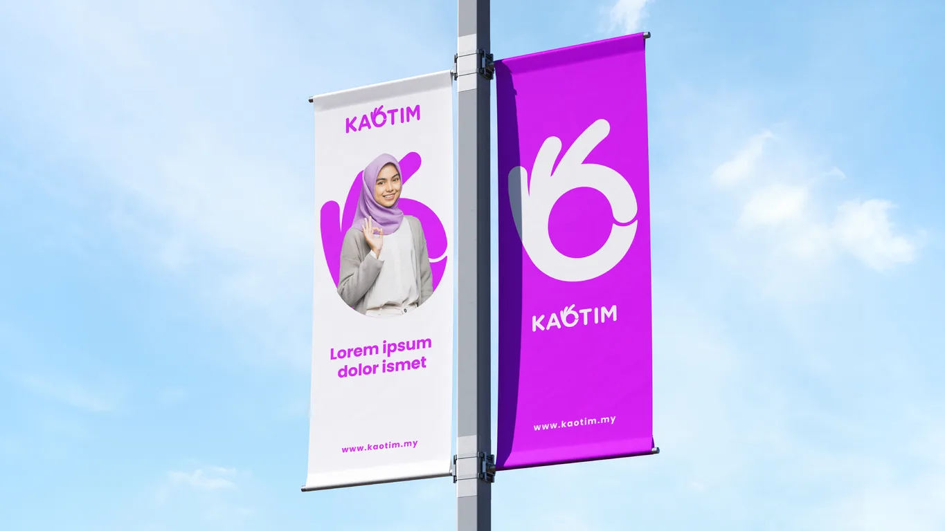 Kaotim lamppost banners in white and purple, one showing a woman making the brand's OK gesture