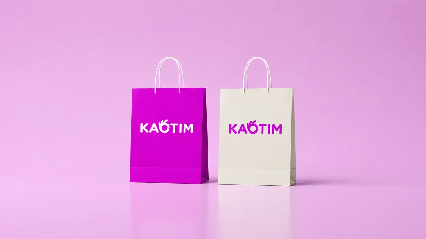 Kaotim paper carrier bags in purple and cream, each printed with the wordmark