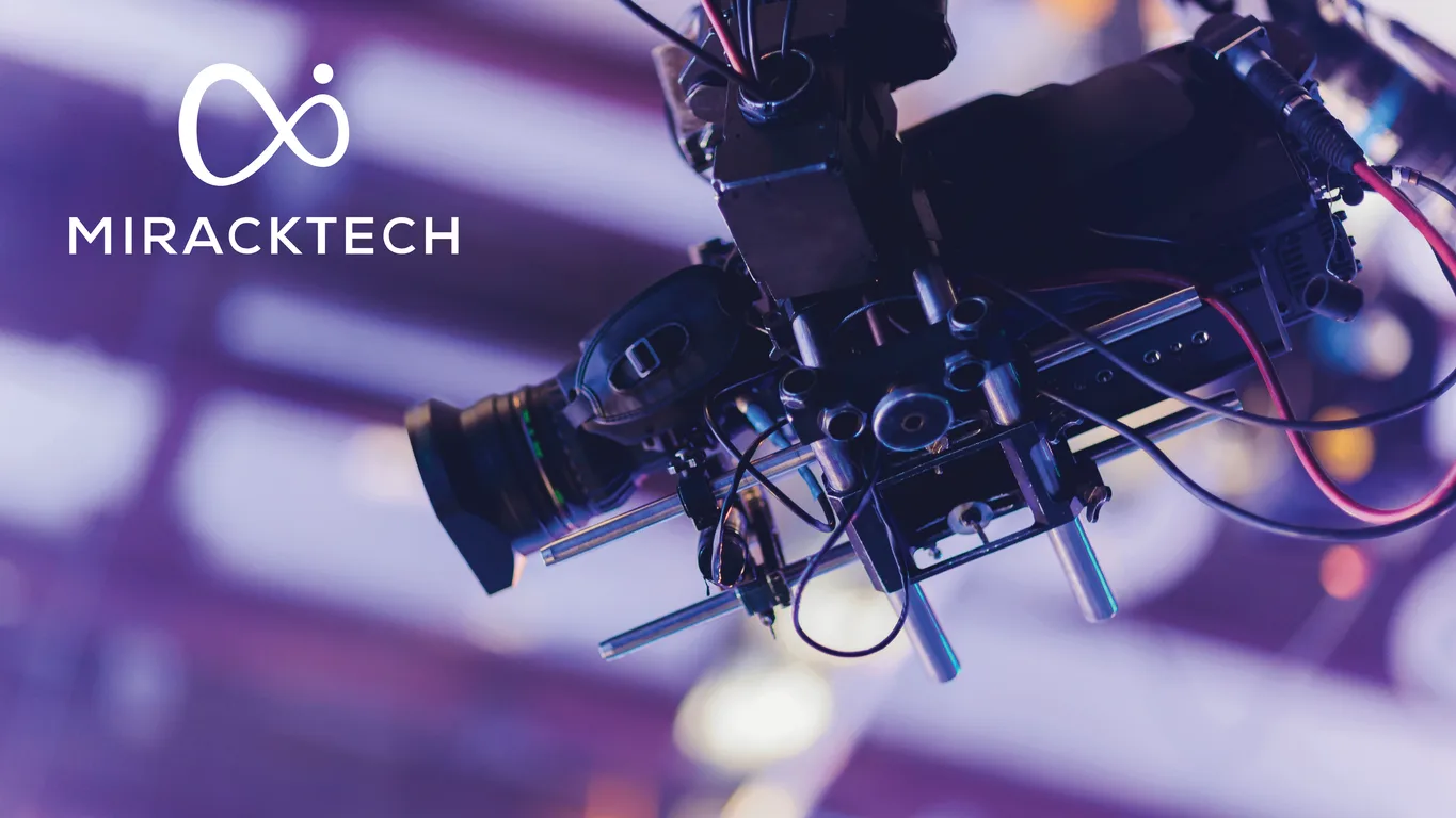 MirackTech logo in white set against a broadcast studio camera on its rig