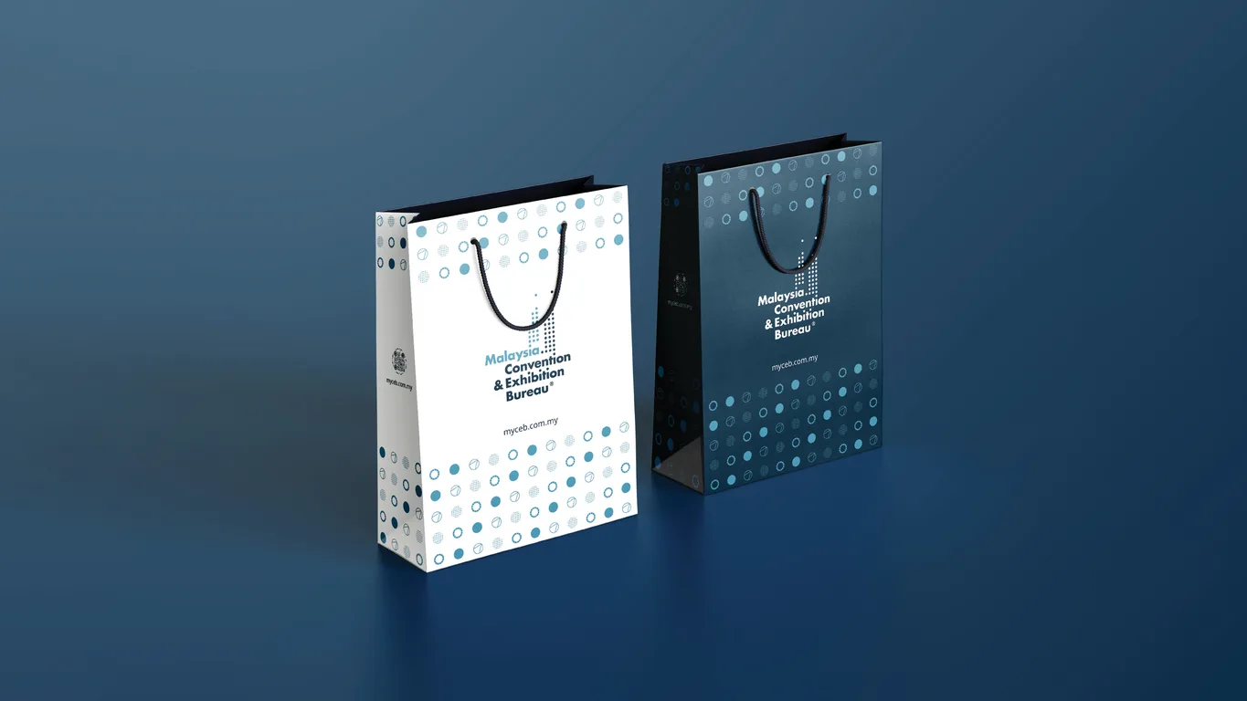 MyCEB paper carrier bags in white and navy with the circle pattern and logo