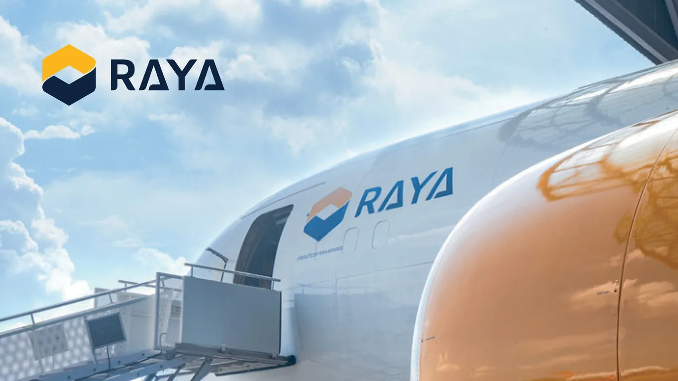 Raya Airways wordmark against the sky above the freighter's nose in the new livery