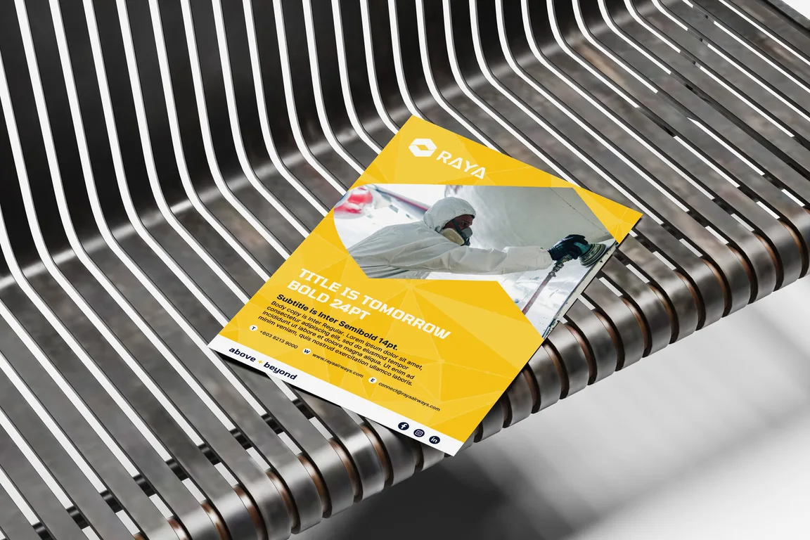 Raya Airways flyer template resting on a slatted bench, yellow panels over a photograph of a technician in protective gear