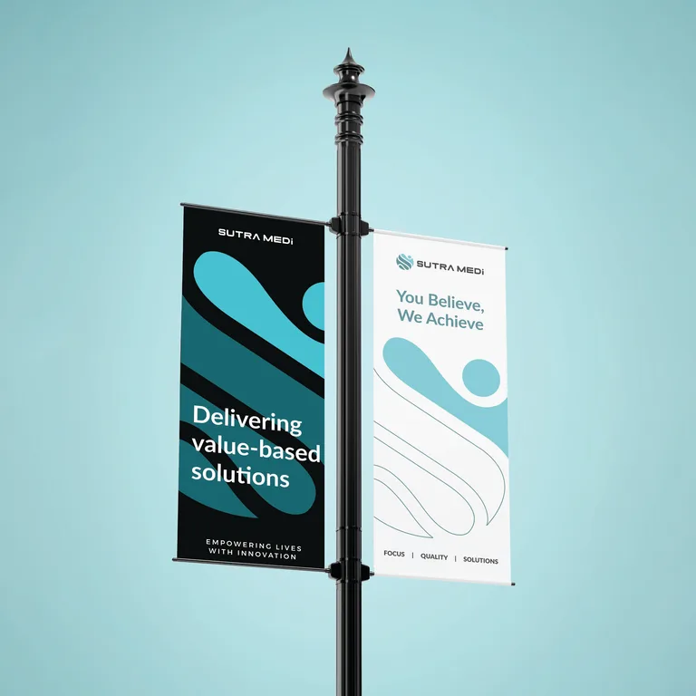 Sutra Medi-Environ street pole banners reading 'Delivering value-based solutions' and 'You Believe, We Achieve'