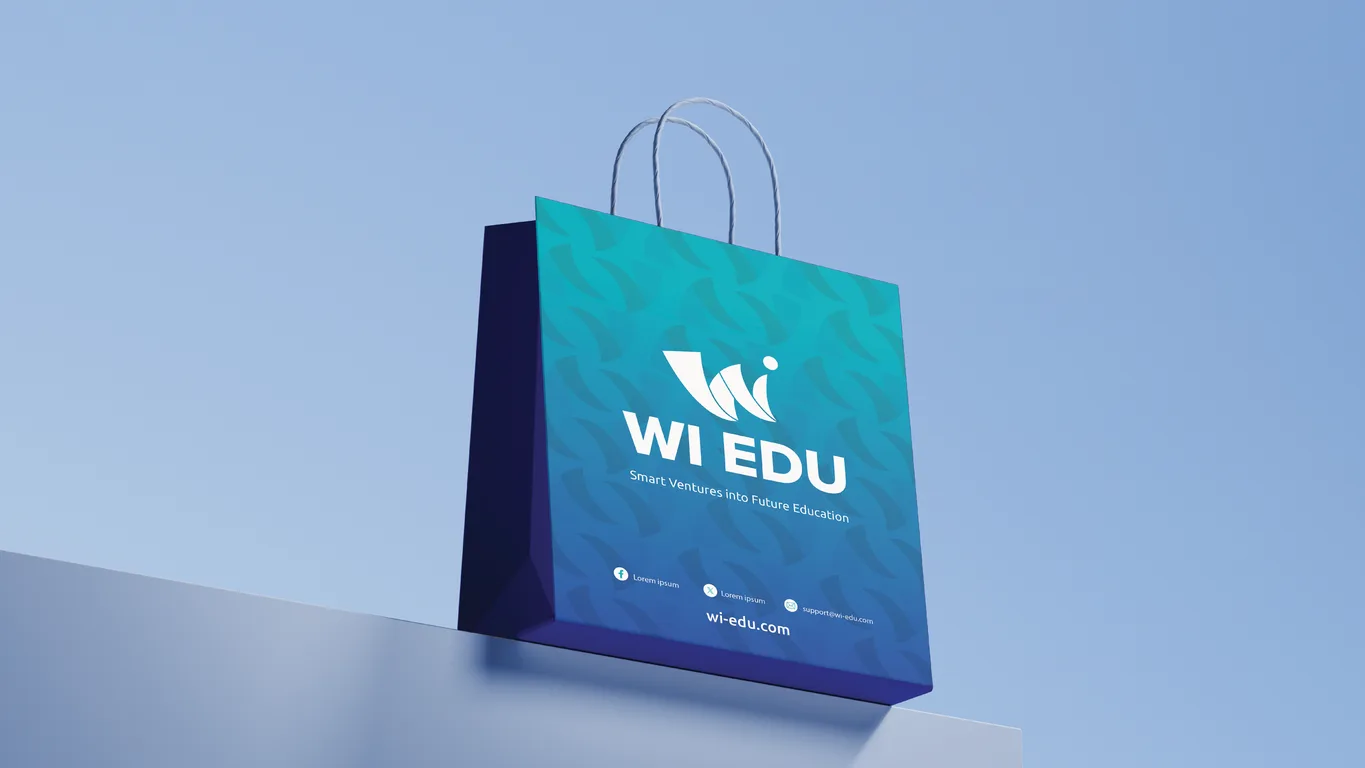 WI Edu paper carrier bag in the turquoise to blue gradient with repeating W pattern