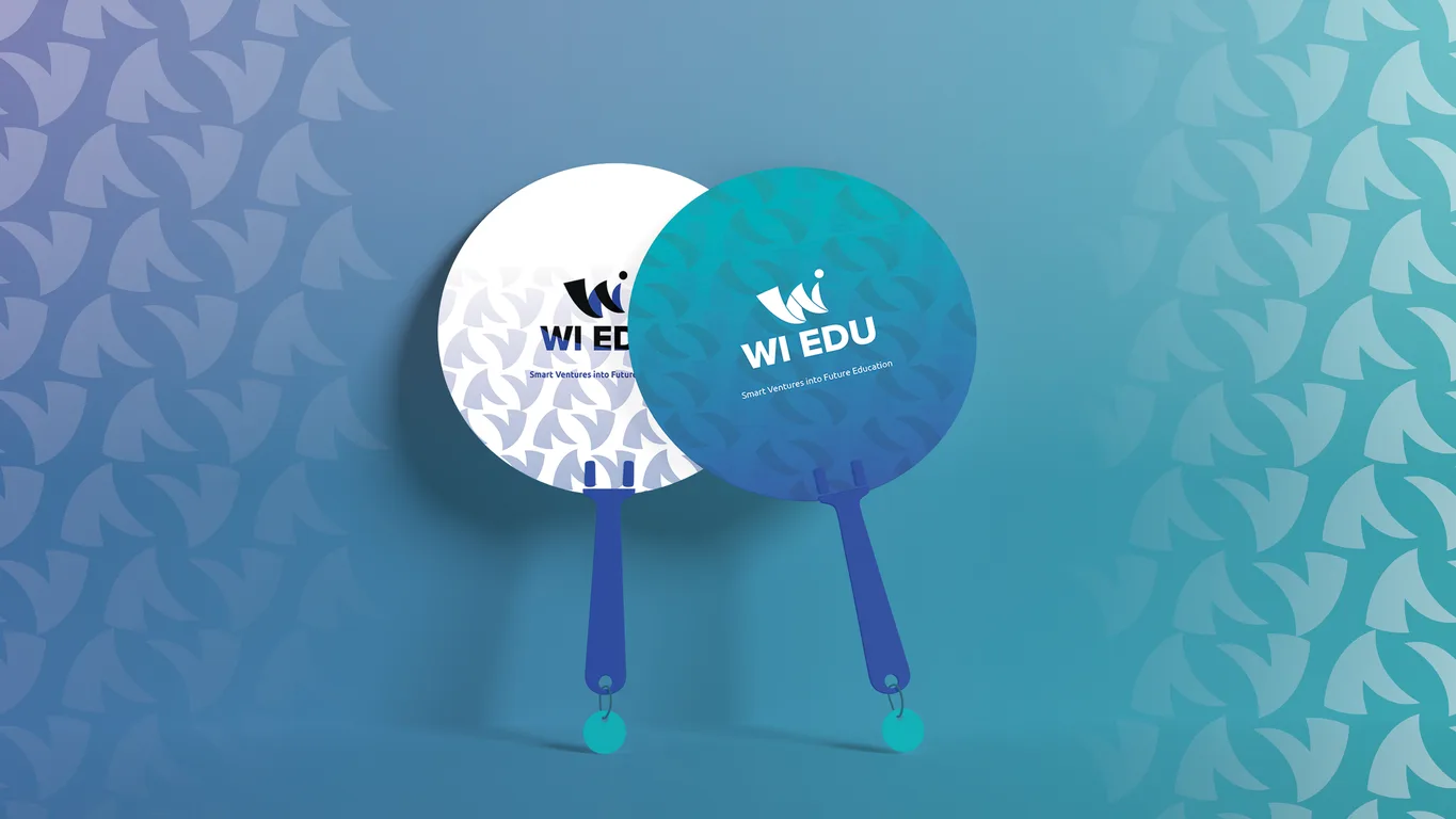 Two WI Edu branded hand fans, one white and one turquoise, carrying the brand tagline