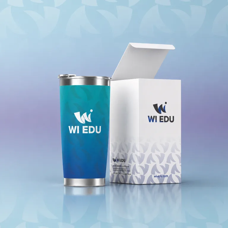 WI Edu branded travel tumbler in the gradient palette beside its patterned white gift box
