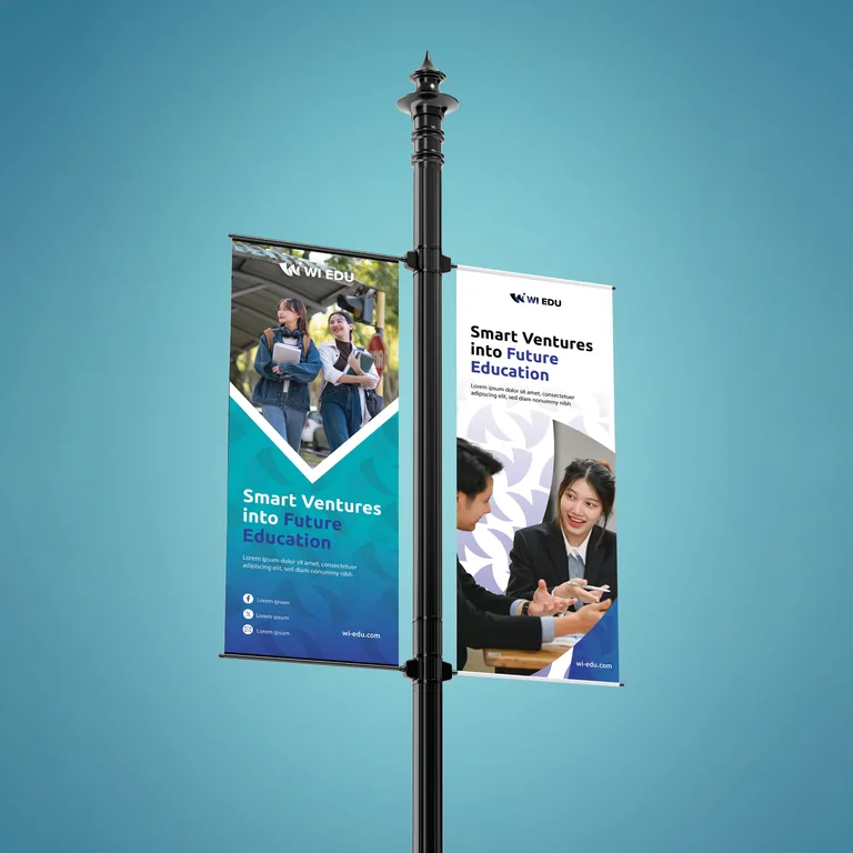 Pair of WI Edu lamp post banners with student and corporate photography under the tagline